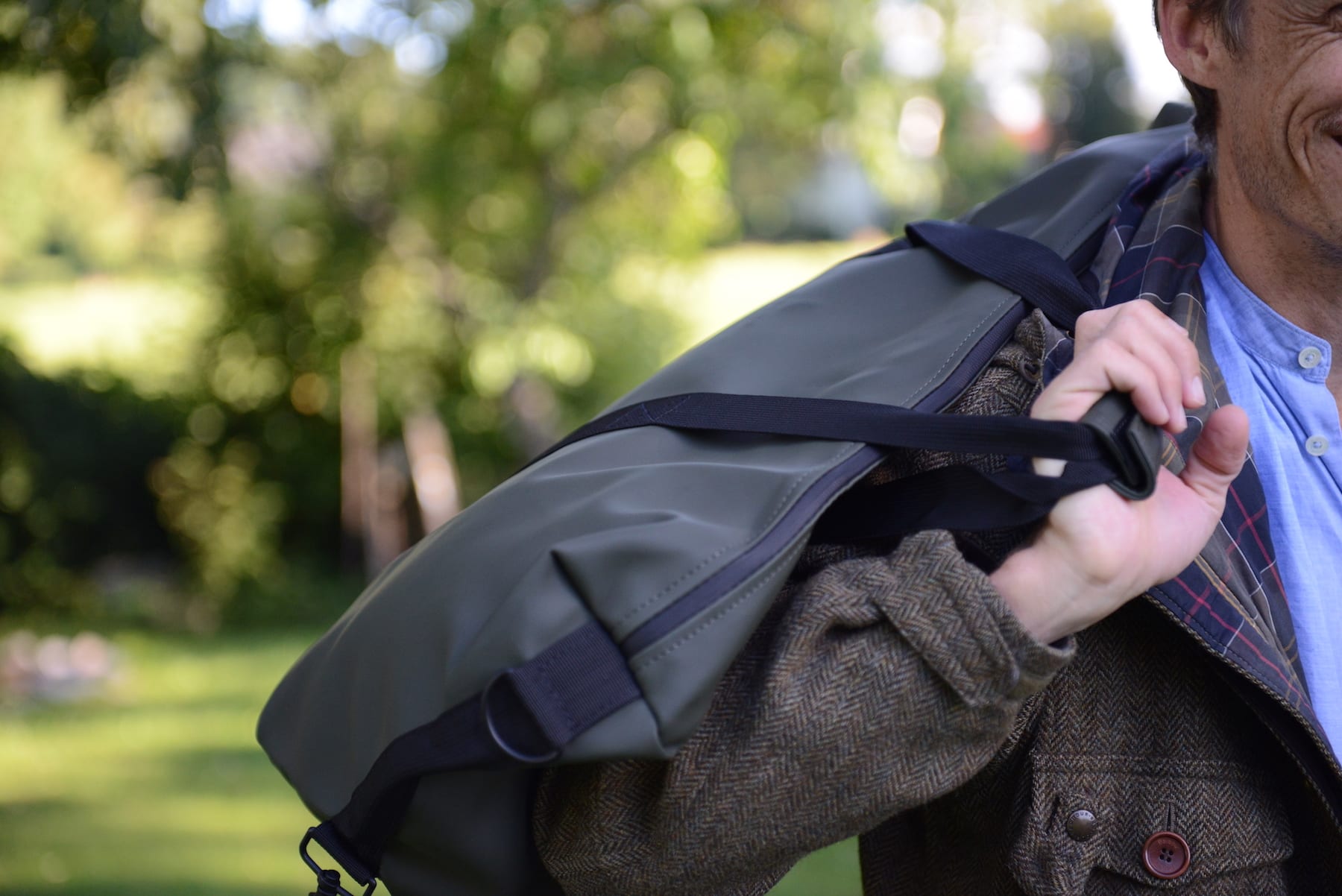 Carrying the Rains bag over the shoulder