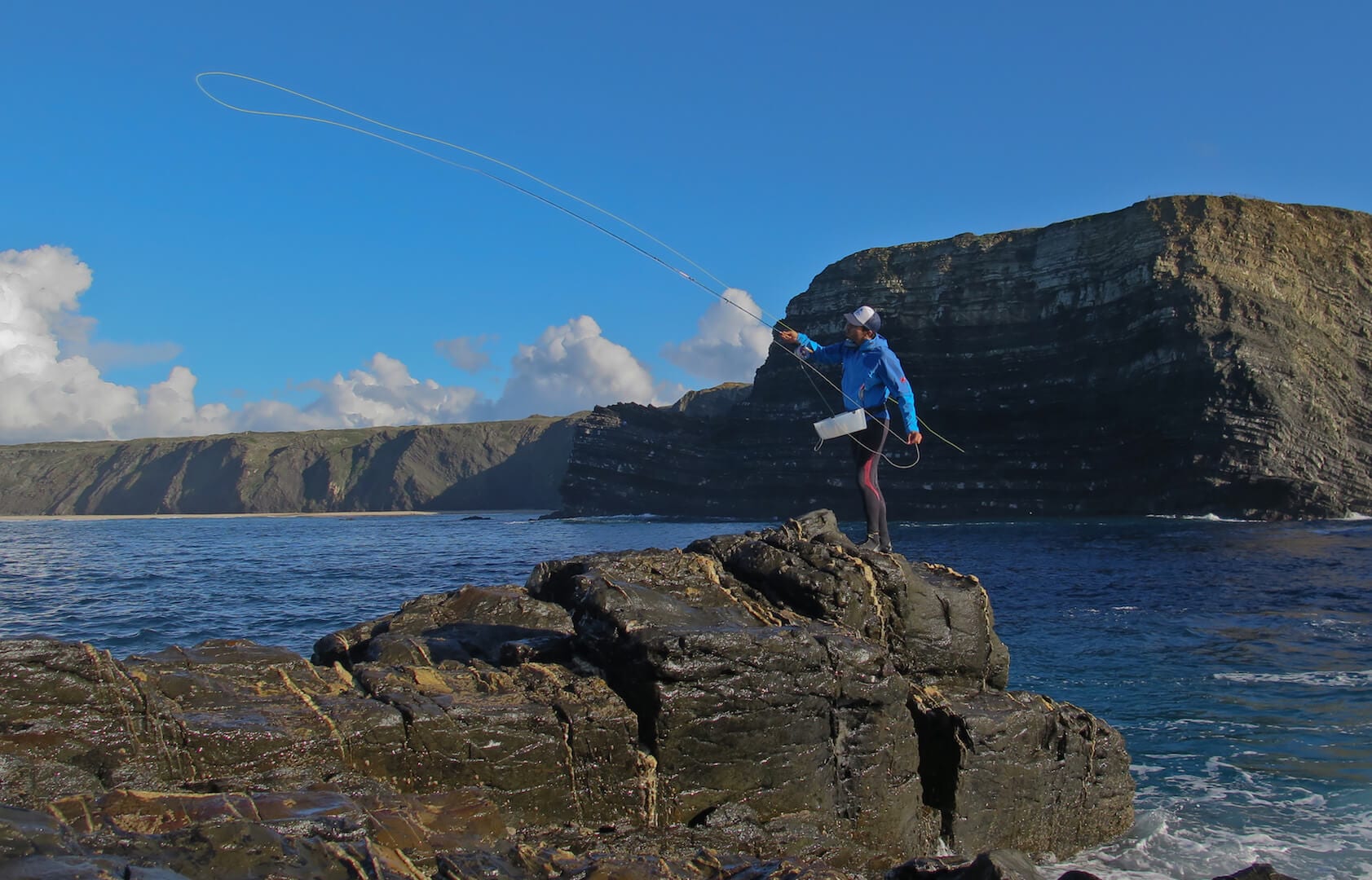 Fly fishermen walking along the shore