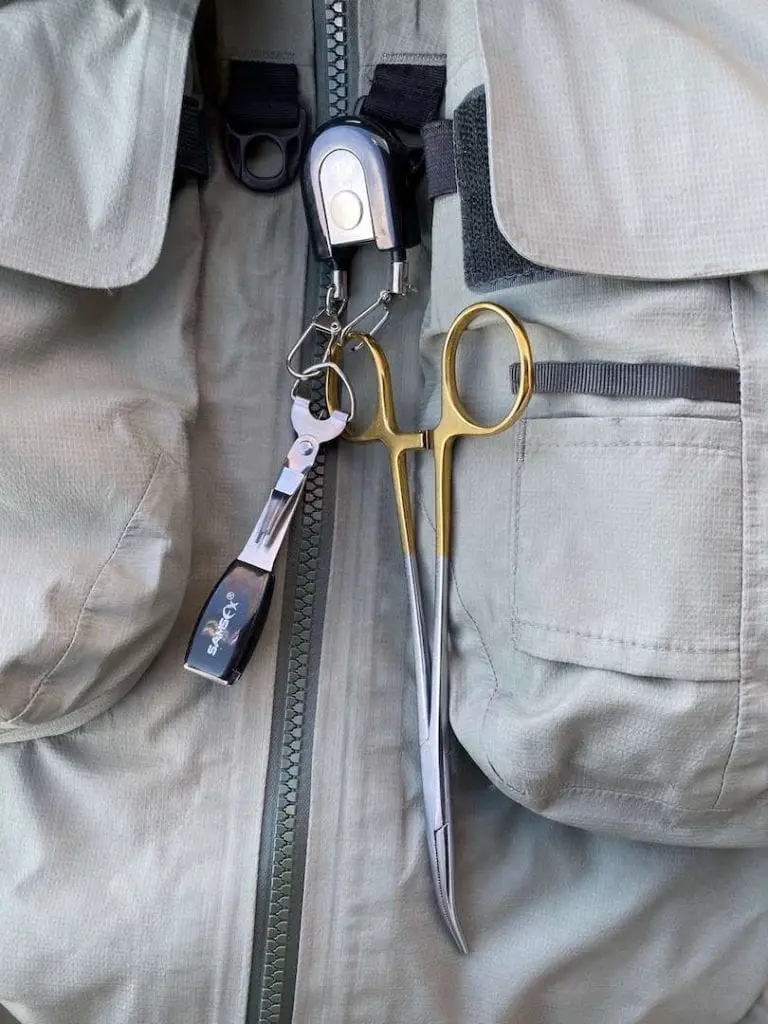 fly fishing pliers on wading jacket