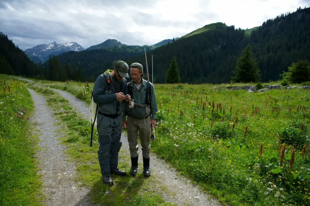 fly fishermen on meadow