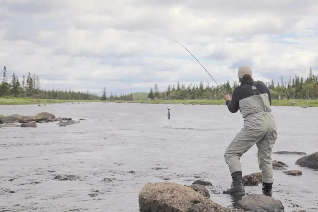 Ina Stevens playing a salmon