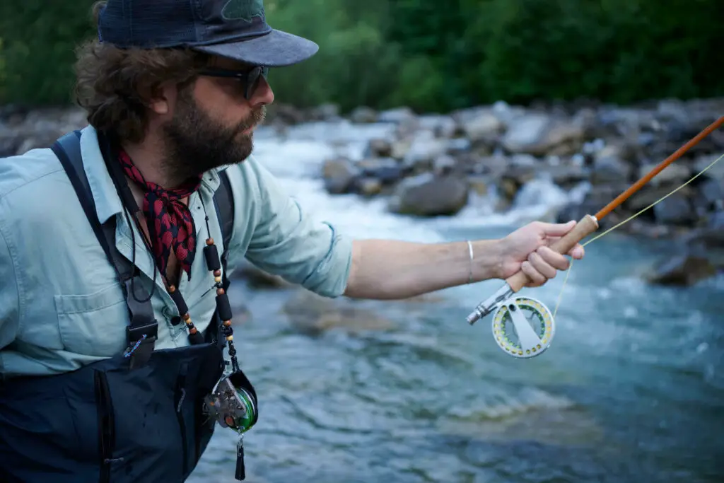 Fly fisherman with fly fishing lanyard