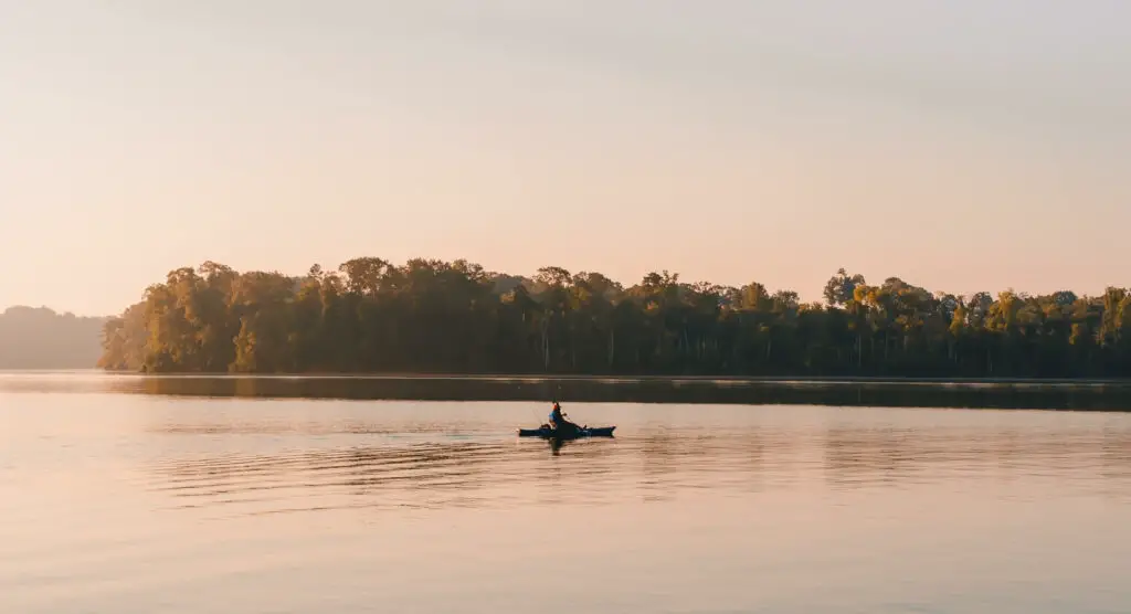 Fisherman in a Fishing Kayak on a Lake