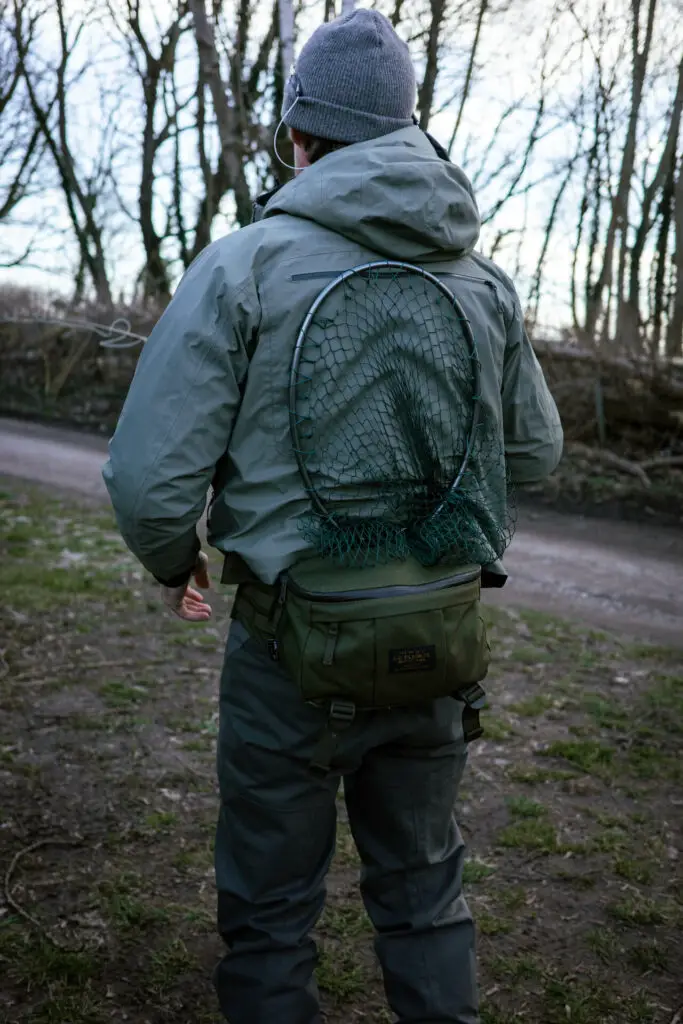 Sea trout fly fishing with landing net