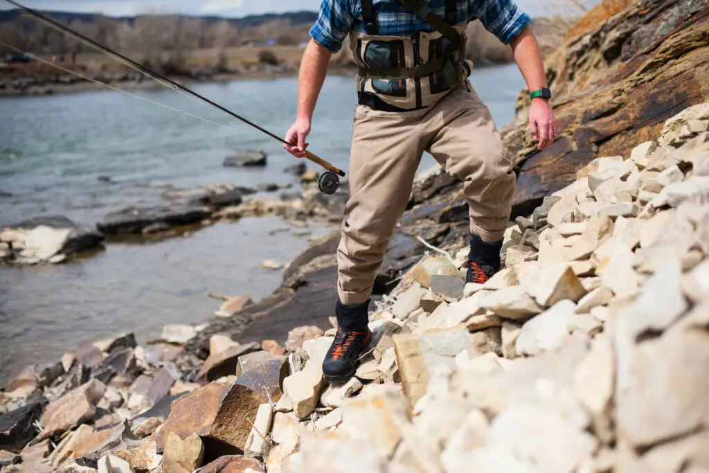 Simms G4 Pro Wading Boot on rocky river edge