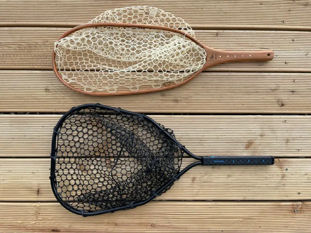 How to choose the right fly fishing net? Two landing nets on a wooden dock