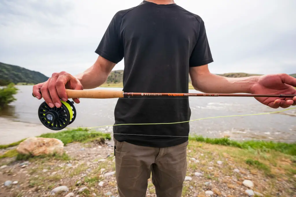 The Redington Original Fly Rod Combo in the hands of a fly fisherman