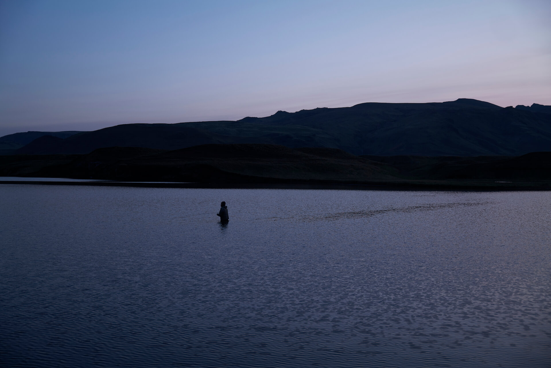 Fishing the lake at Heidarvatn, Iceland on a late evening