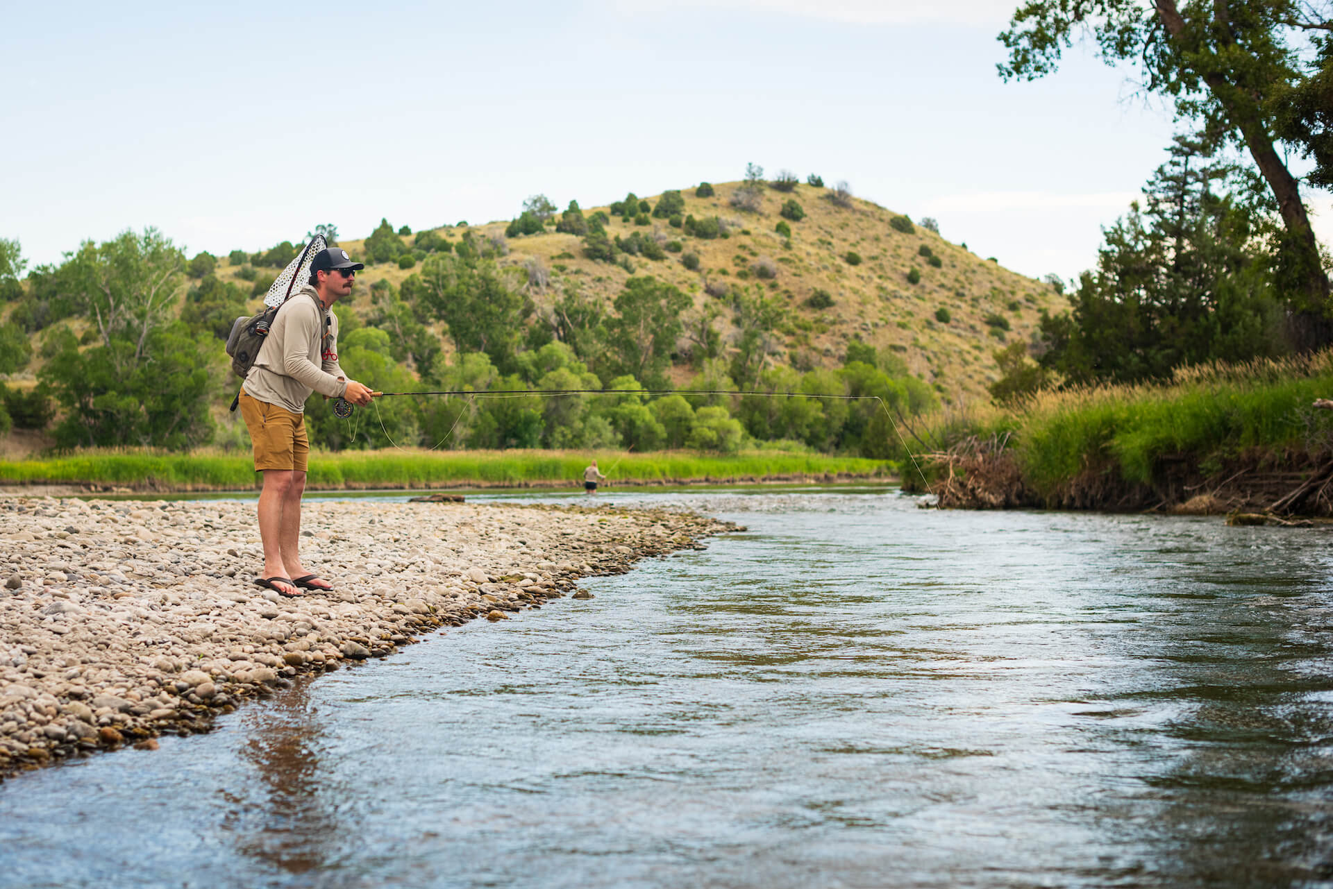 Fly fisherman wet wading in Montana.