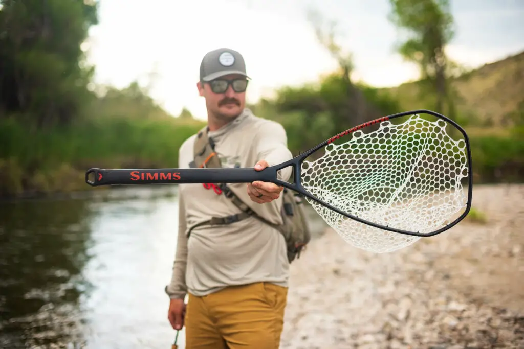 Fly fishing landing net closeup: Lens color fishing sunglasses guide