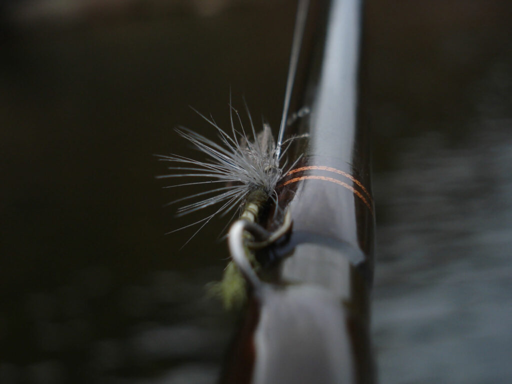 A fly fishing flink attached to a fly rod and detail of the blank: fly fishing minimalism 