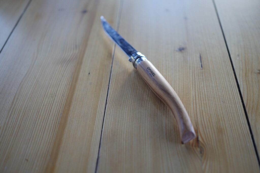 Opinel Slim Line No 12 Knife on a table