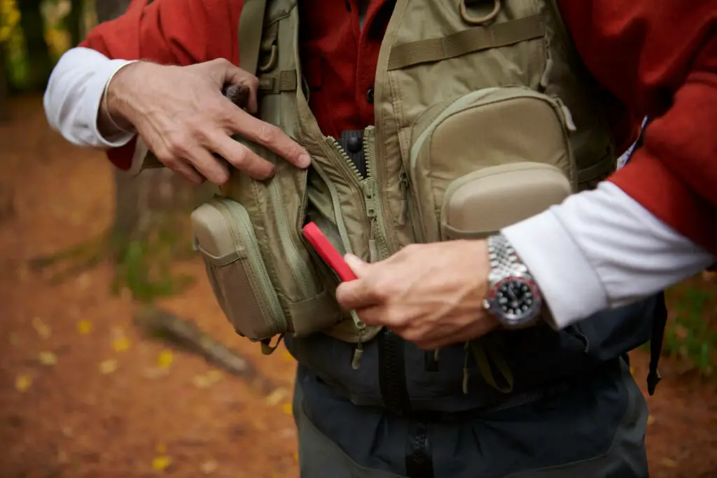 The Filson fishing guide vest comes with so many zippered pockets that you won't have any issue fitting a lot of fly boxes, extra tippet spools or your smartphone.