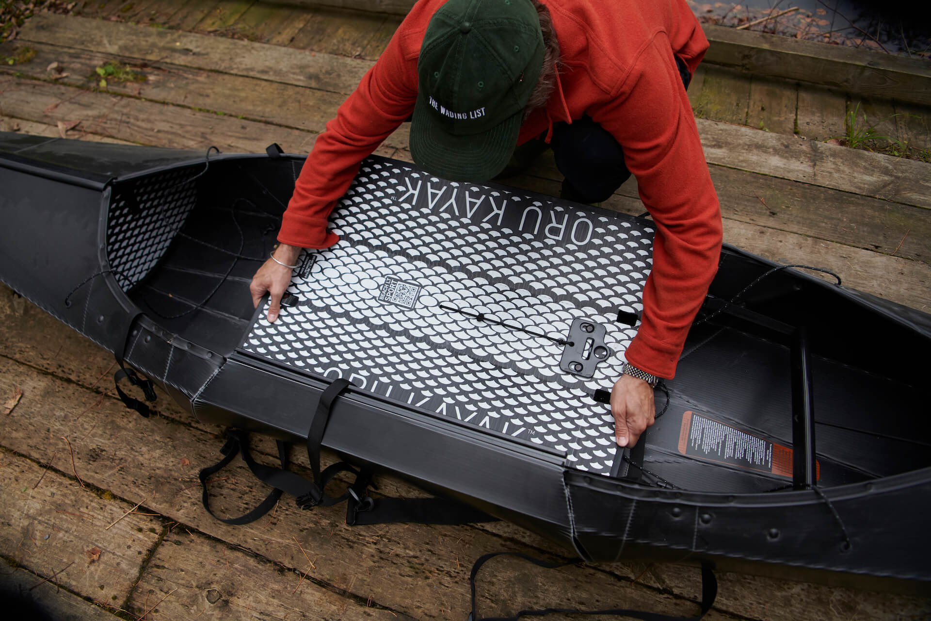 Putting the floor plate into the Oru Beach Kayak