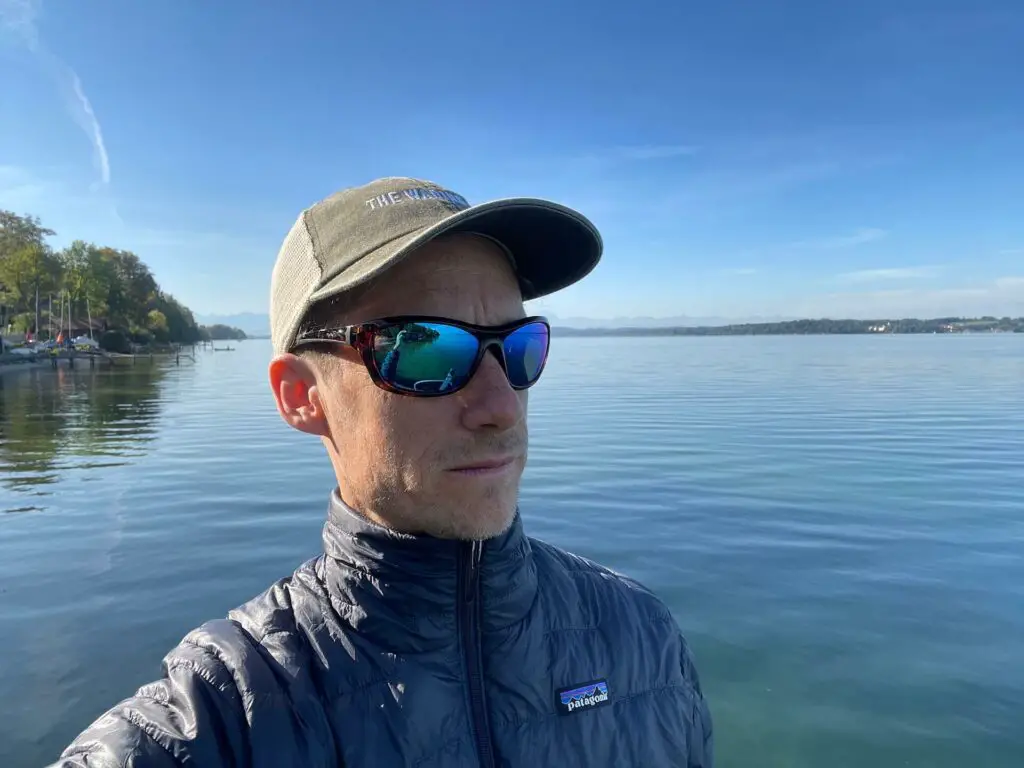 Wiley X Glory Review: Fly fisherman at lake shore