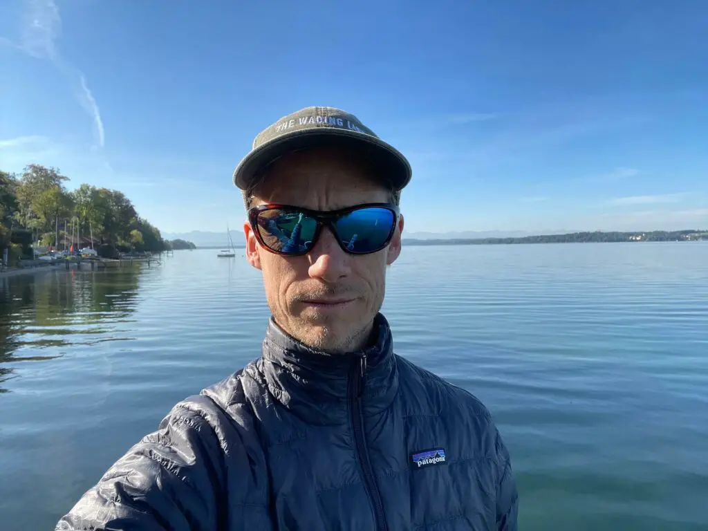 Wiley X Glory Review: Fly fisherman at lake shore