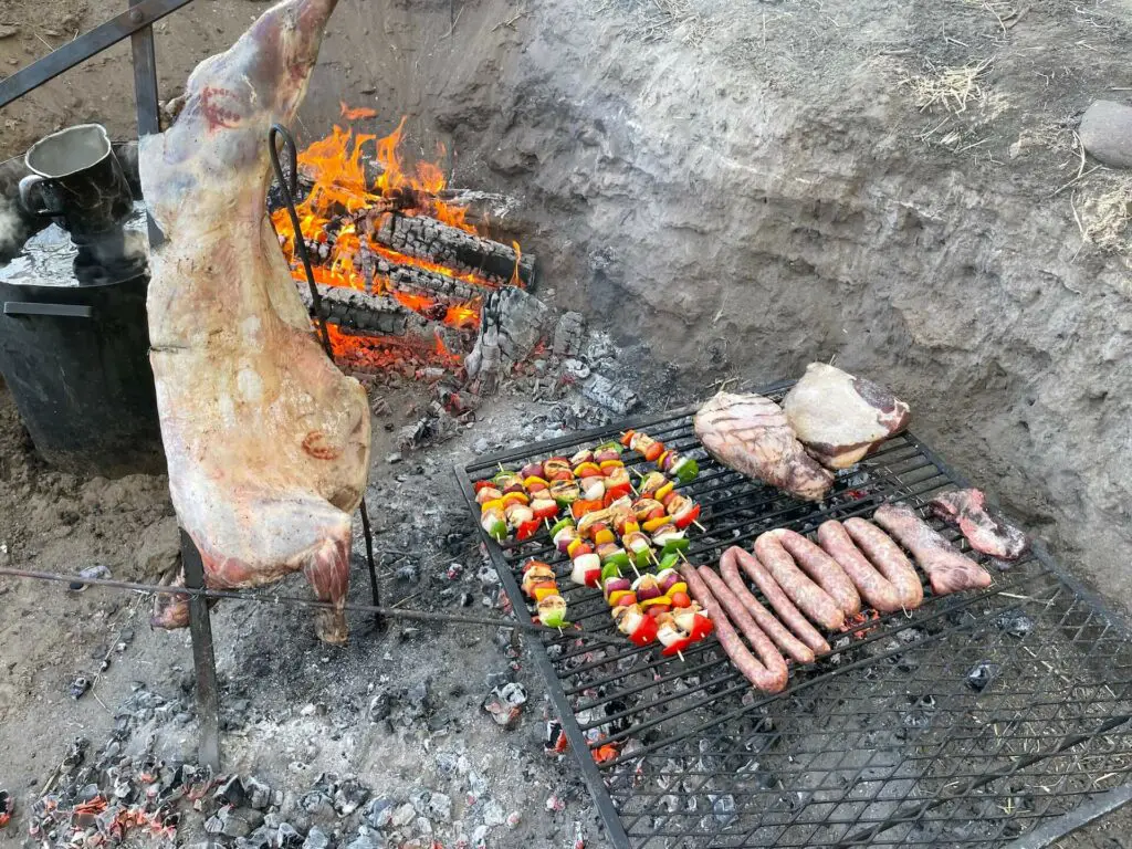 Roasted lamb with grilled ribeye steaks, sausages and vegetables made for a perfect asado or
traditional Argentine barbeque. (Photo by Jim Schmiedeskamp)