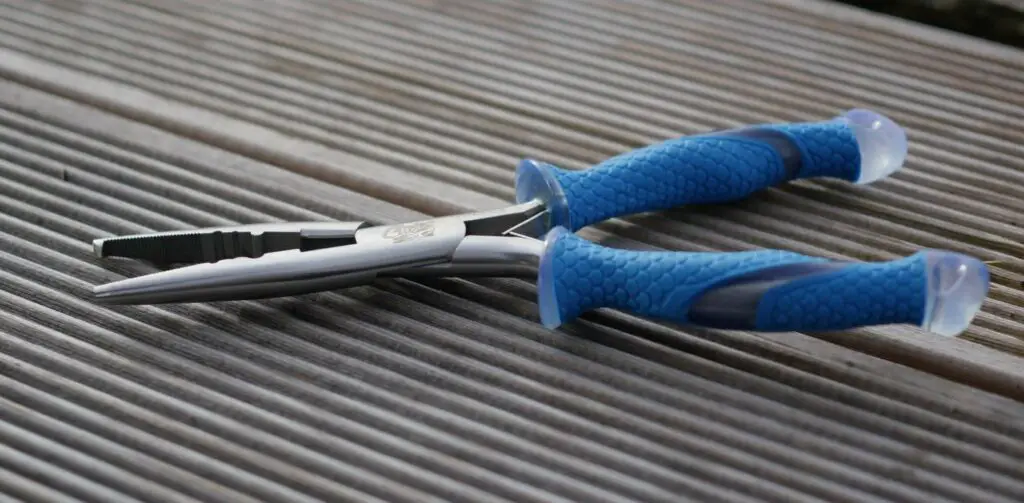 Cuda Fishing Pliers on Wooden Deck