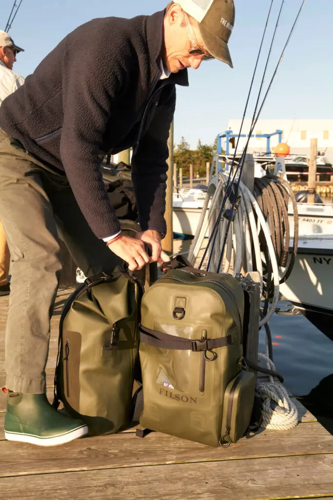 The Filson Dry Backpack and the Filson Dry Rolltop during our testing in Montauk, NY. Photo: Christian Anwander © The Wading List