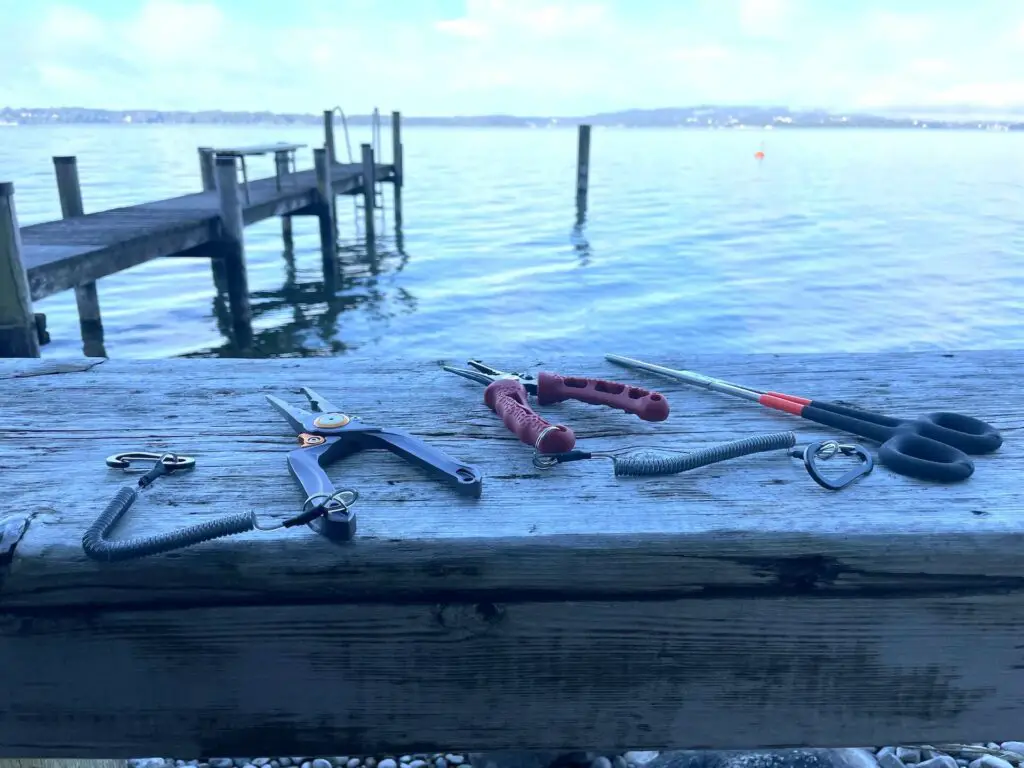 Fishing pliers on wooden dock