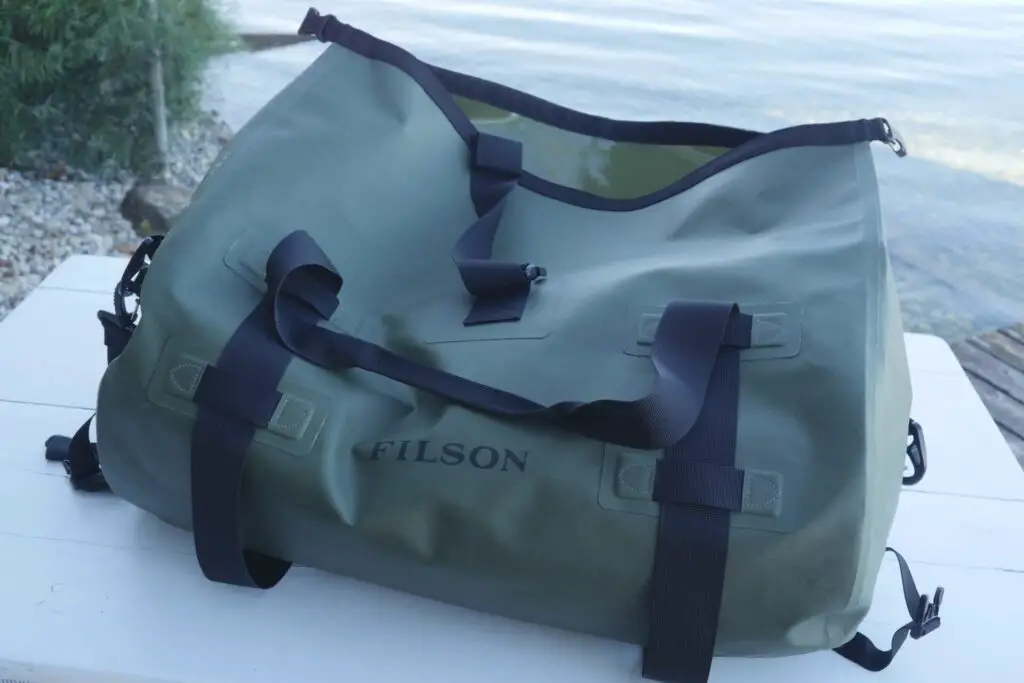Filson Medium Dry Duffel Bag on table