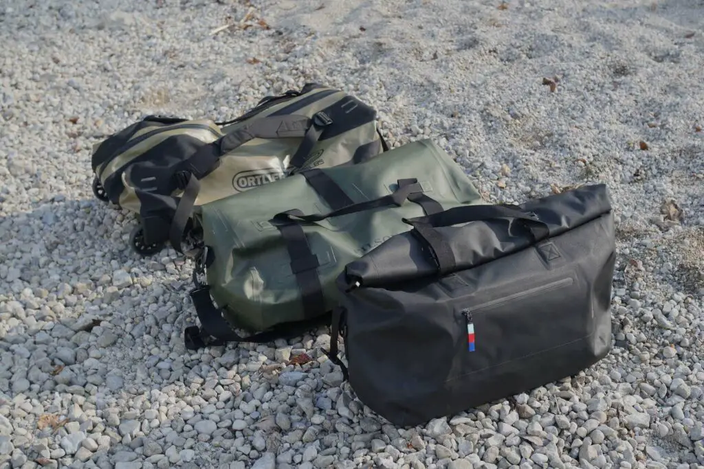 waterproof duffel bags on gravel