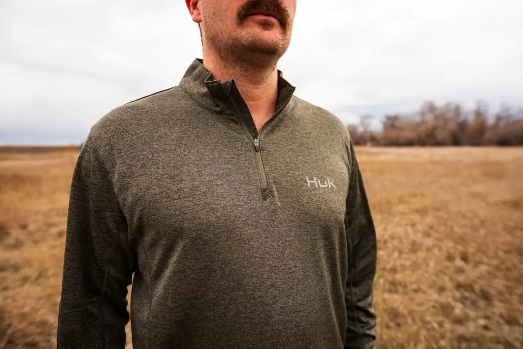 Wearing the Huk Camden Coldfront Quarter Zip during some winter trout fishing in Montana.