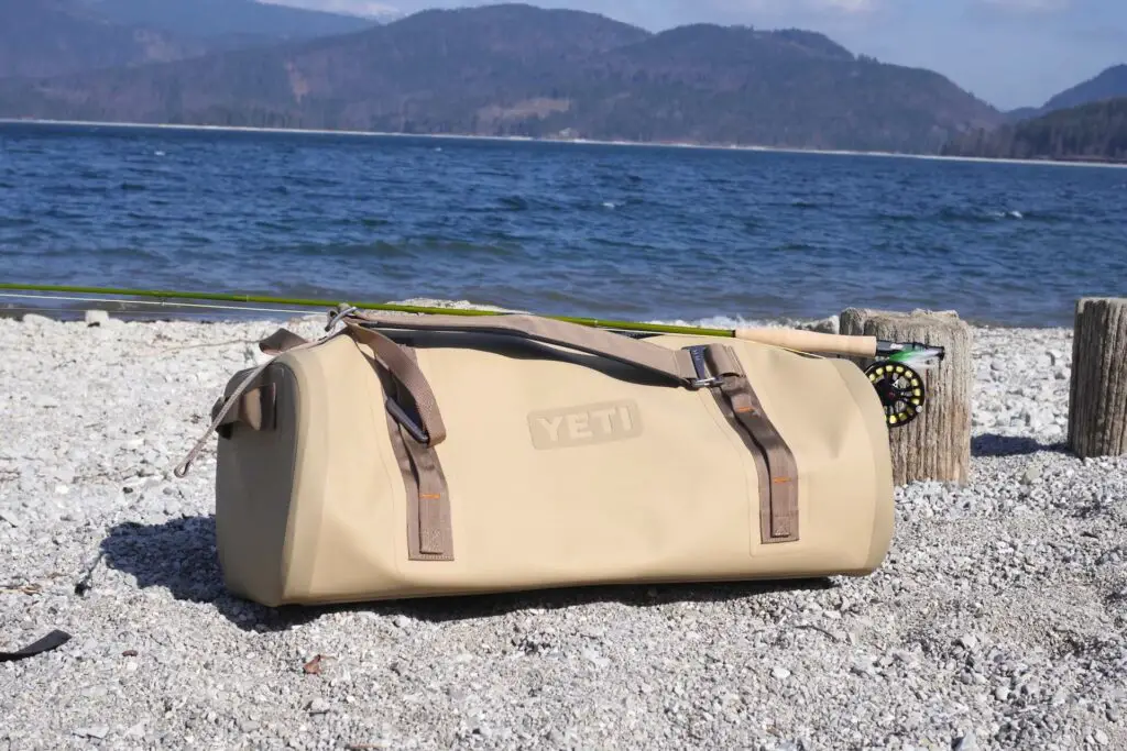 YETI Panga 75 Duffel on lake shore