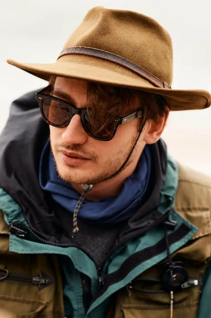Fly fisherman wearing the Island Optics Beachcomber Sunglasses in Brown