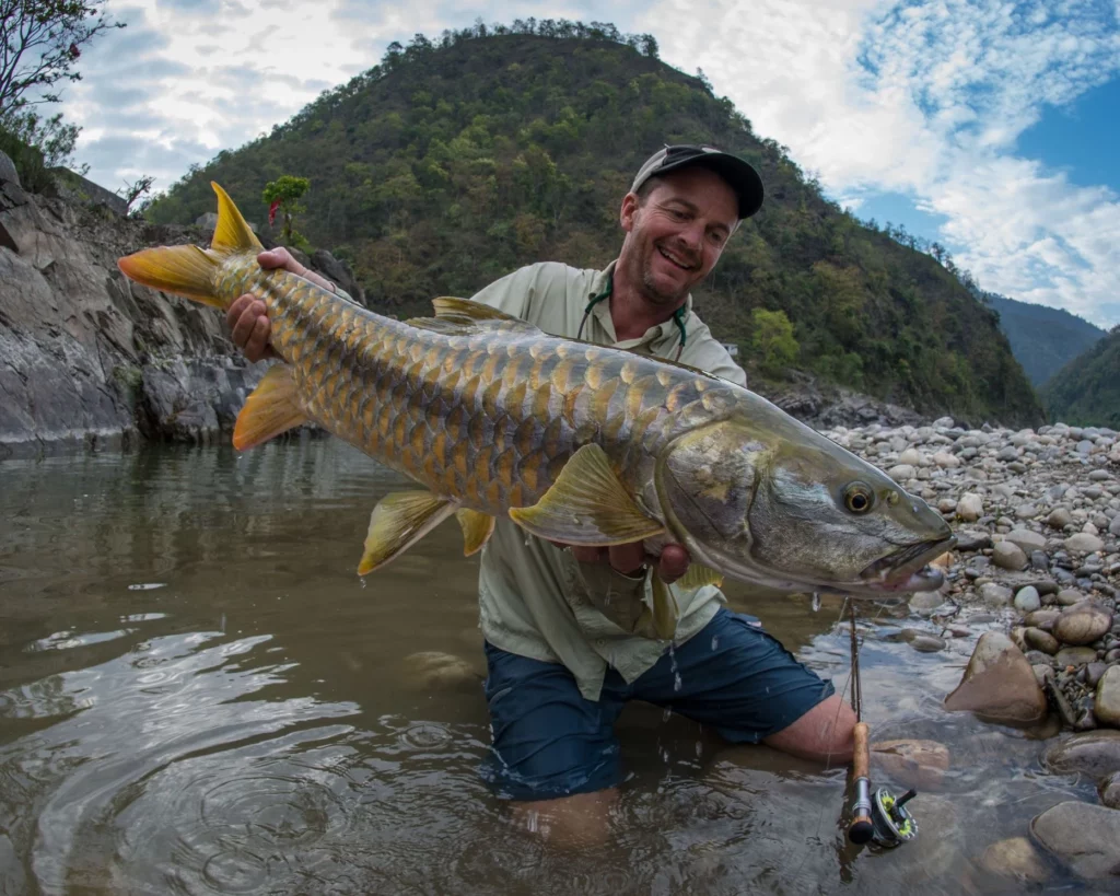 A Golden Mahseer caught on a fly - Photo: © Klug - Yellowdog Fly Fishing