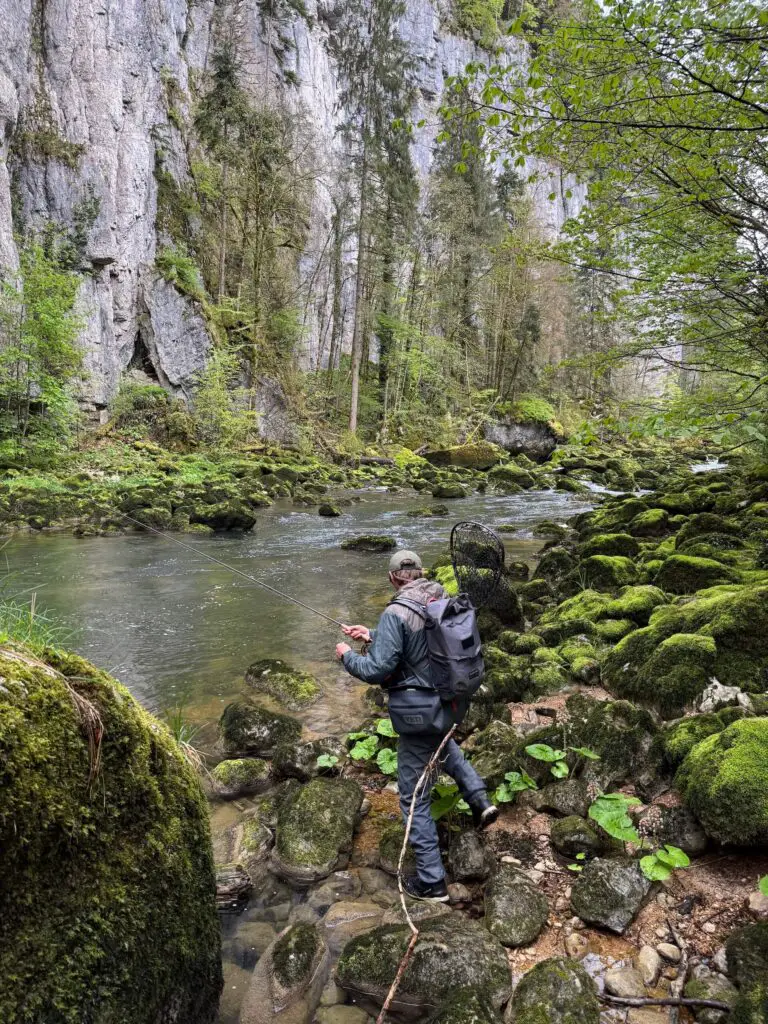 Fly fisherman fishing a wet canyon