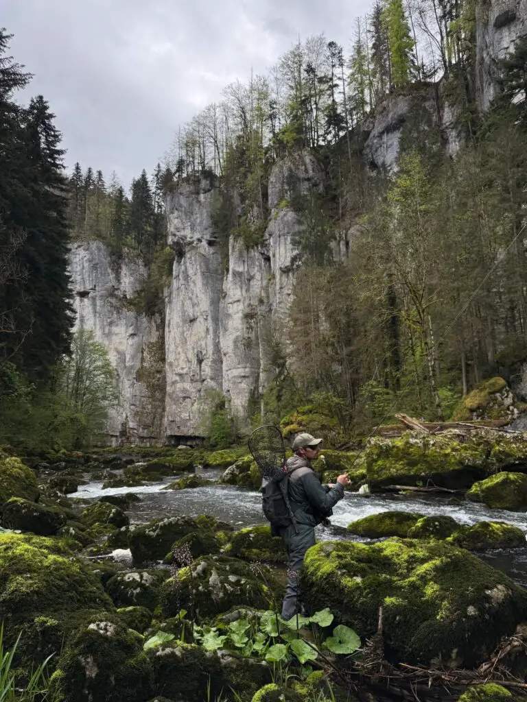 Fly fisherman fishing a canyon