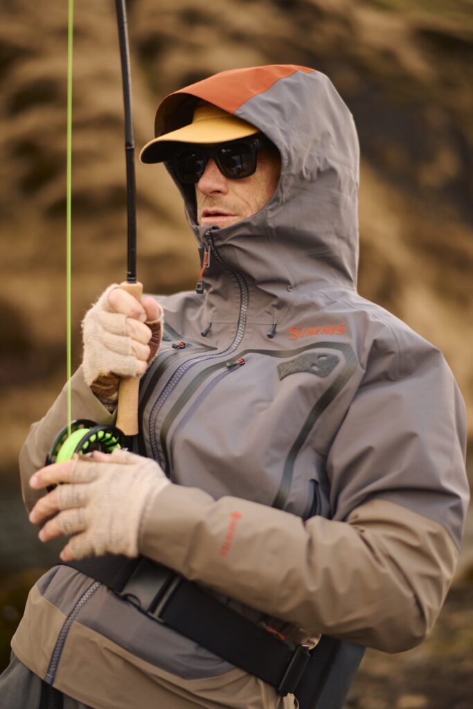 Fisherman fighting a fish with Wading Jacket