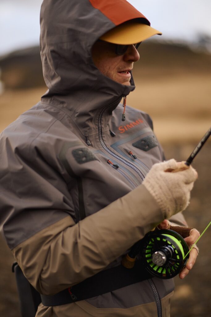 Fisherman fighting a fish with Wading Jacket