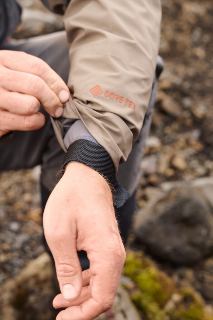 Fisherman fighting a fish with Wading Jacket