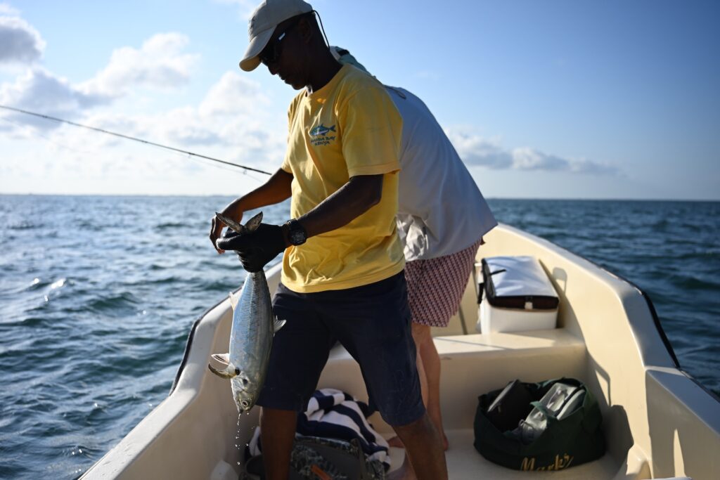 Fly fishing guide handling a fish